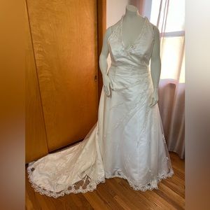 Ivory beaded embroidered halter gown with train. Corset back